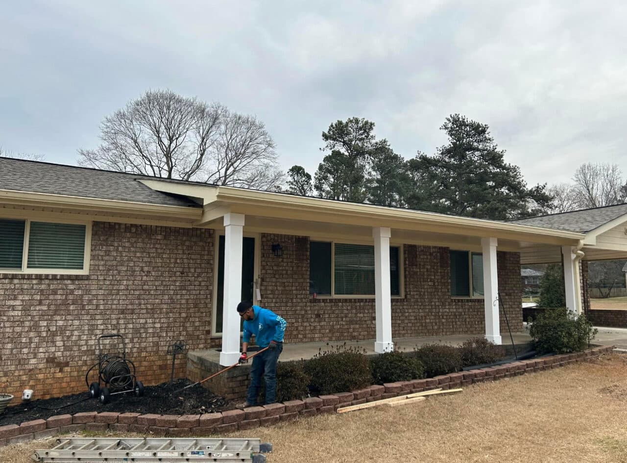 Built shed roof over front porch and replaced siding on gable