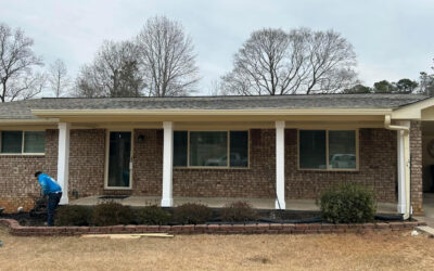 Built shed roof over front porch and replaced siding on gable.